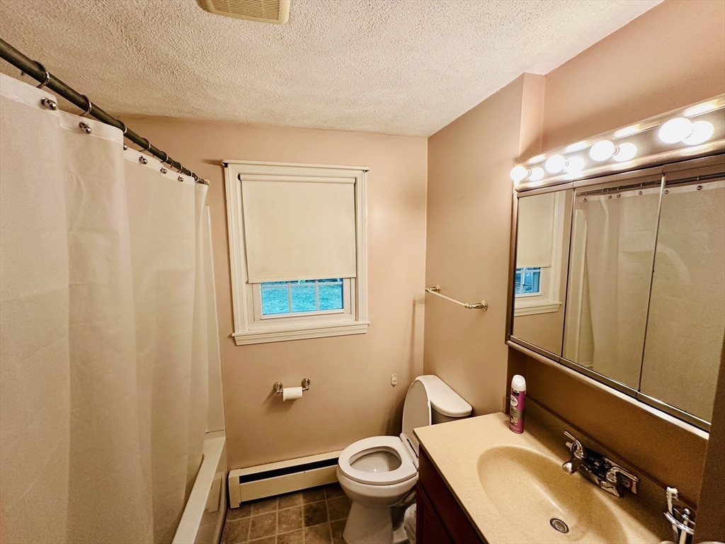 64 Maplewood Drive Townsend, MA 01469 - Photo 14 of 18 a bathroom with a sink a toilet and shower