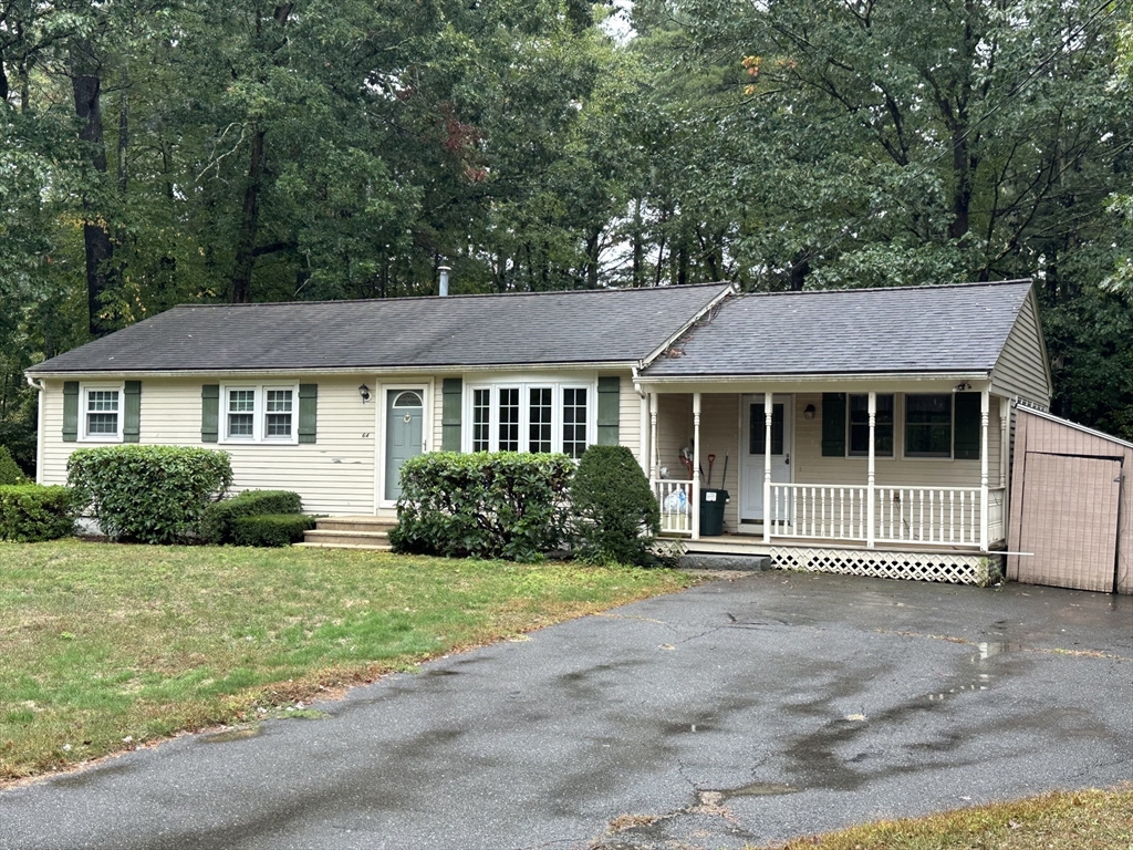64 Maplewood Drive Townsend, MA 01469 - Photo 2 of 18 a front view of a house with a garden