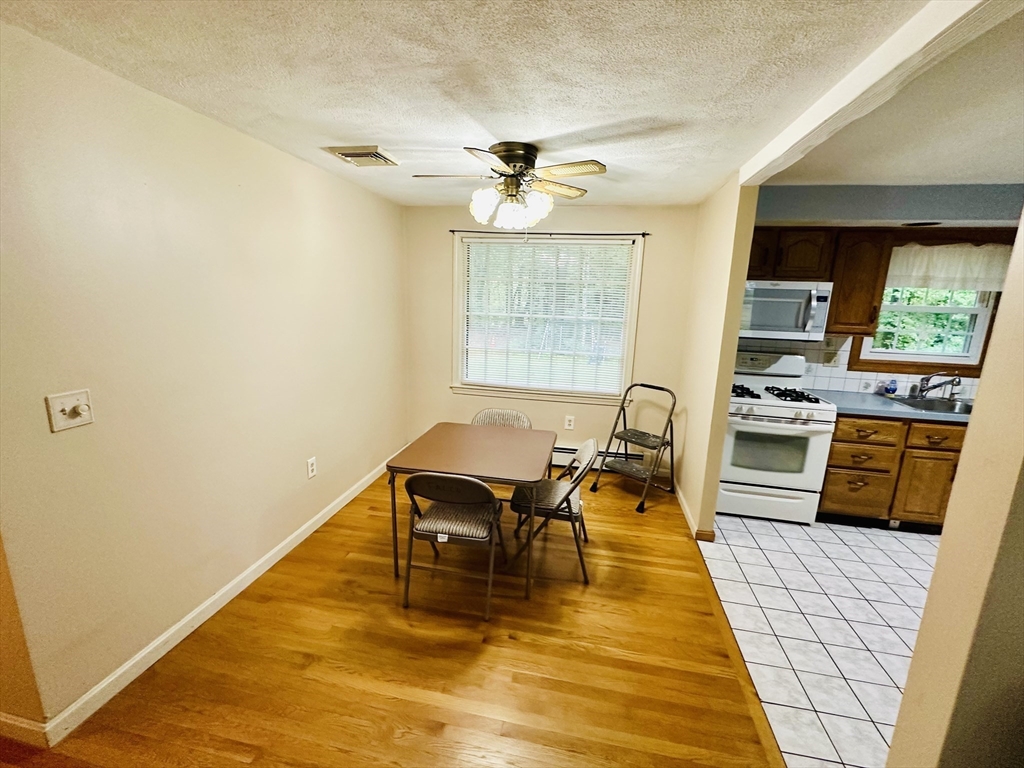 64 Maplewood Drive Townsend, MA 01469 - Photo 7 of 18 a living room with furniture and a flat screen tv