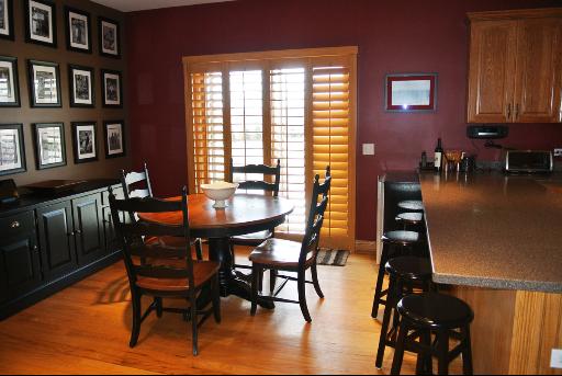 8405 Eagle Ridge Spring Grove, IL 60081 - Photo 3 of 16 a view of a dining room with furniture and chandelier