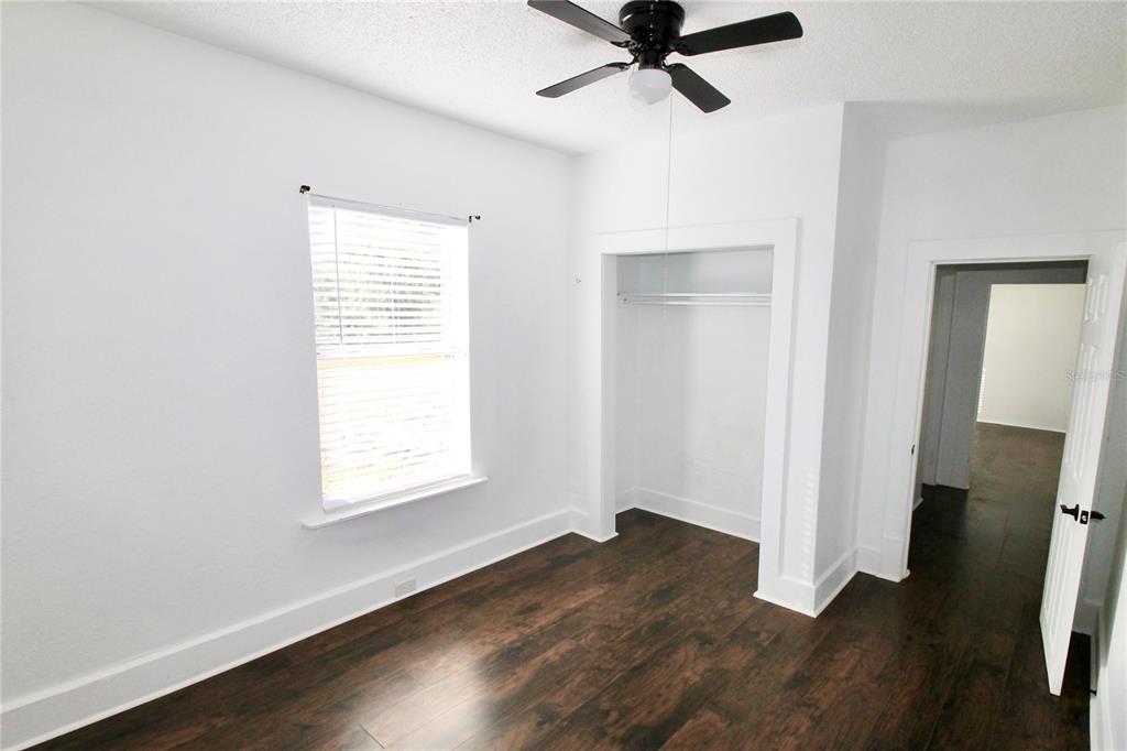 610 Dundee Road Dundee, FL 33838 - Photo 20 of 42 a view of a room with wooden floor and windows