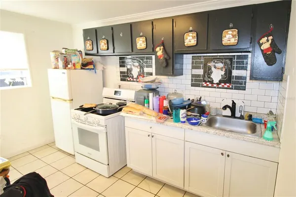 a kitchen with furniture and cabinets