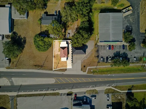 an aerial view of a houses with outdoor space
