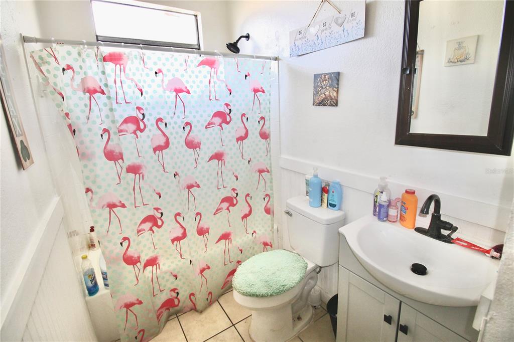 610 Dundee Road Dundee, FL 33838 - Photo 32 of 42 a bathroom with a sink toilet and vanity