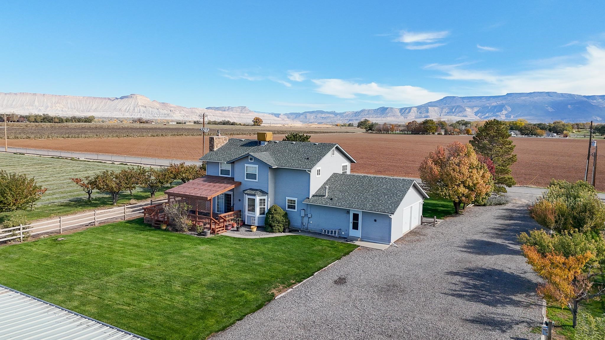 273 30 Road Grand Junction, CO 81503 - Photo 2 of 42 an aerial view of a house with garden space and ocean view