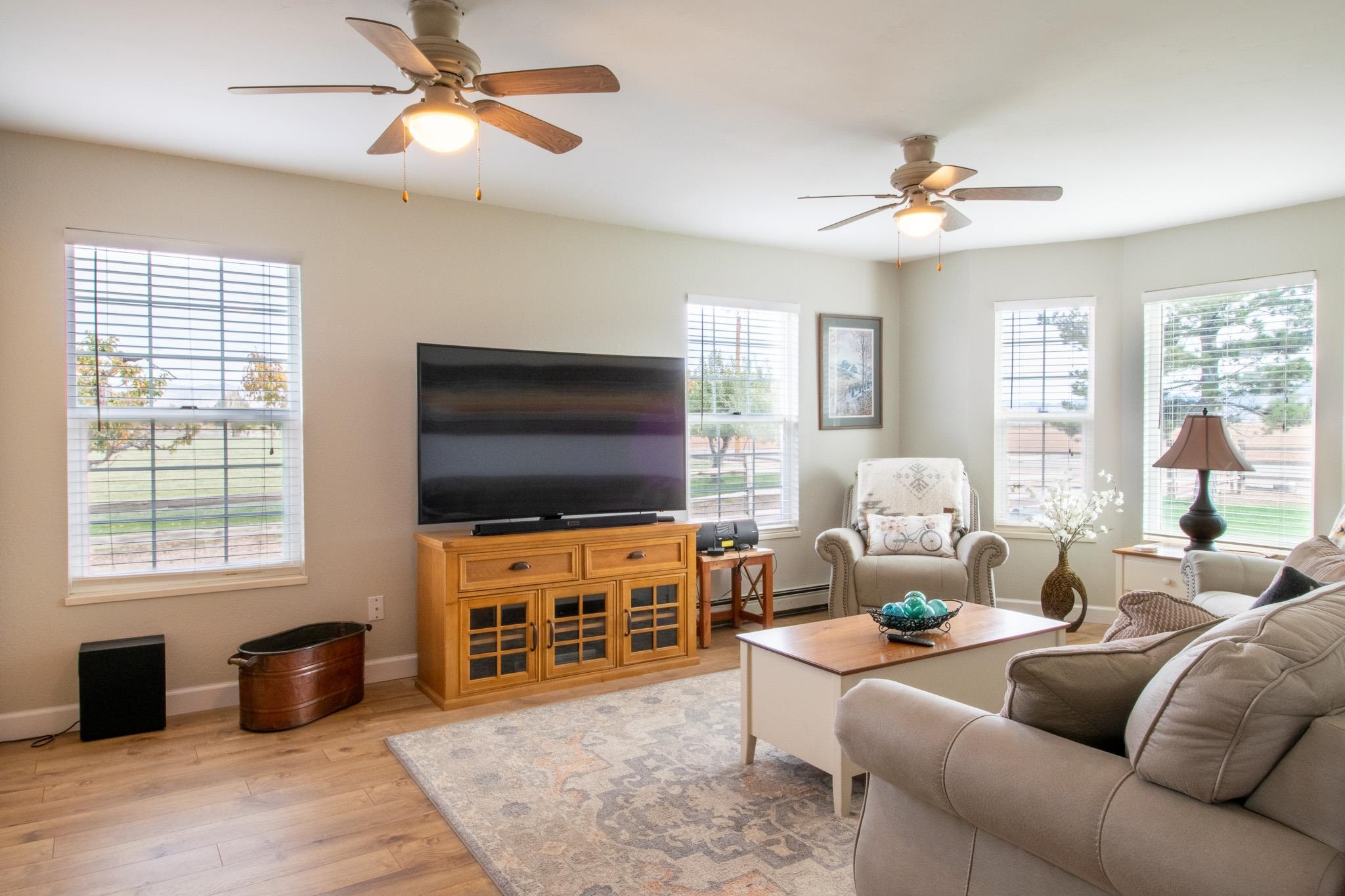 273 30 Road Grand Junction, CO 81503 - Photo 4 of 42 a living room with furniture and a flat screen tv