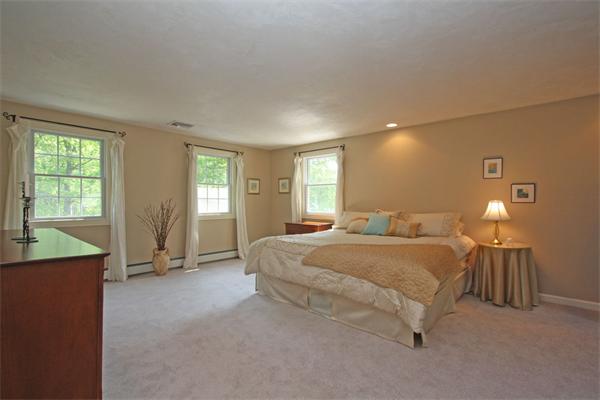 157 Kaleva Road Lancaster, MA 01523 - Photo 14 of 26 a spacious bedroom with a bed and window