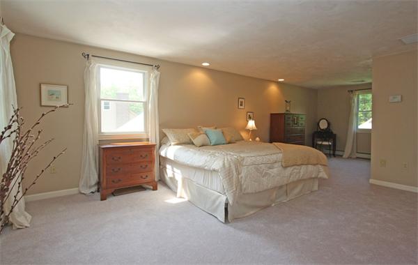 157 Kaleva Road Lancaster, MA 01523 - Photo 15 of 26 a bedroom with a bed and a table