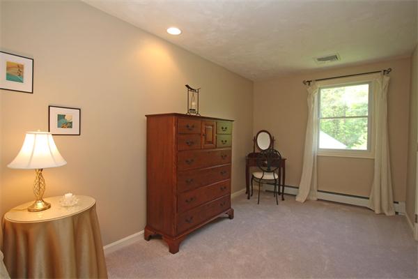 157 Kaleva Road Lancaster, MA 01523 - Photo 16 of 26 a bedroom with a bed and a lamp