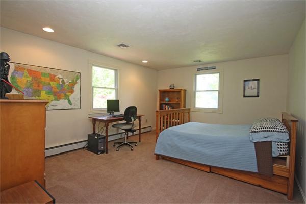 157 Kaleva Road Lancaster, MA 01523 - Photo 18 of 26 a bedroom with a bed and wooden floor