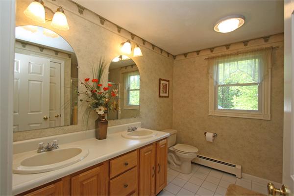 157 Kaleva Road Lancaster, MA 01523 - Photo 19 of 26 a bathroom with a granite countertop sink toilet and shower