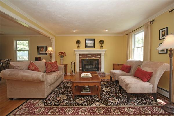 157 Kaleva Road Lancaster, MA 01523 - Photo 2 of 26 a living room with furniture and a fireplace