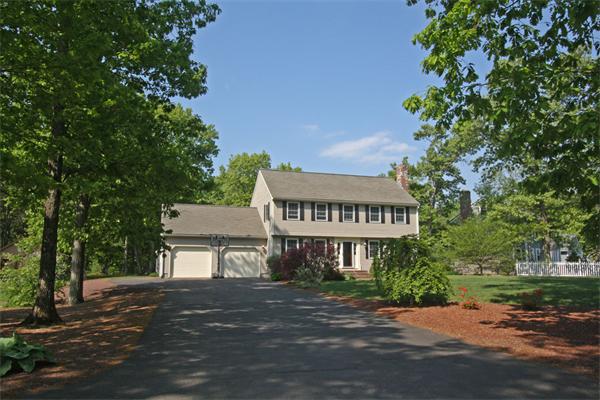157 Kaleva Road Lancaster, MA 01523 - Photo 25 of 26 a front view of a house with a yard and garage