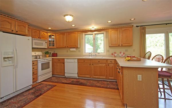 157 Kaleva Road Lancaster, MA 01523 - Photo 6 of 26 a kitchen with granite countertop a sink stainless steel appliances and cabinets