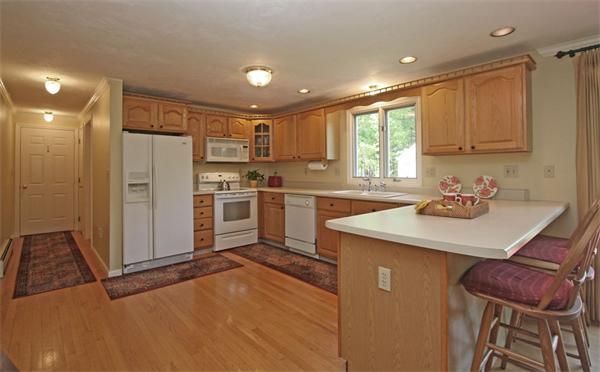 157 Kaleva Road Lancaster, MA 01523 - Photo 9 of 26 a kitchen with stainless steel appliances granite countertop a sink stove and refrigerator