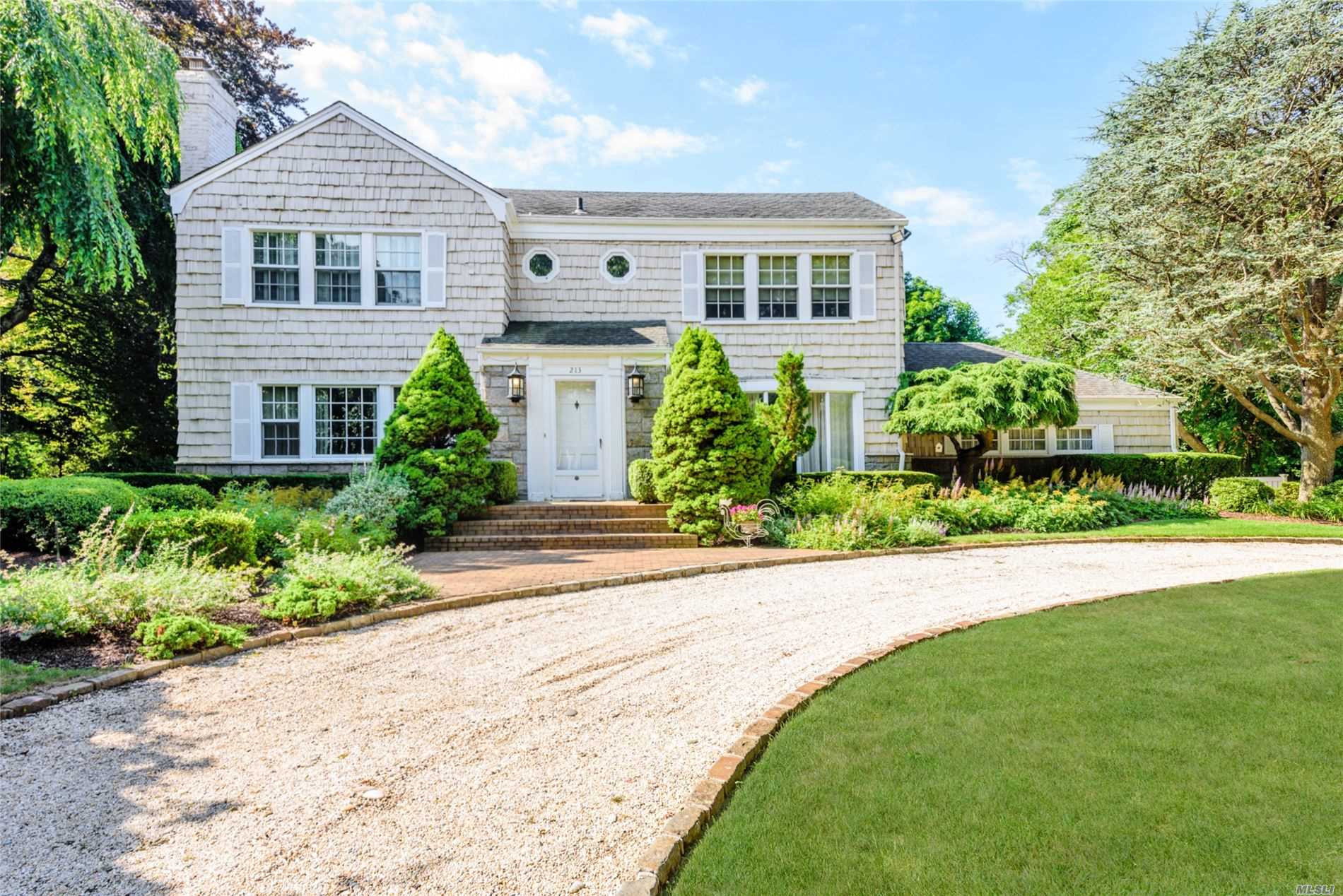 213 Albon Road Hewlett, NY 11557 - Photo 1 of 1 front view of a house and a yard