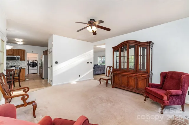 a bedroom with furniture and a ceiling fan