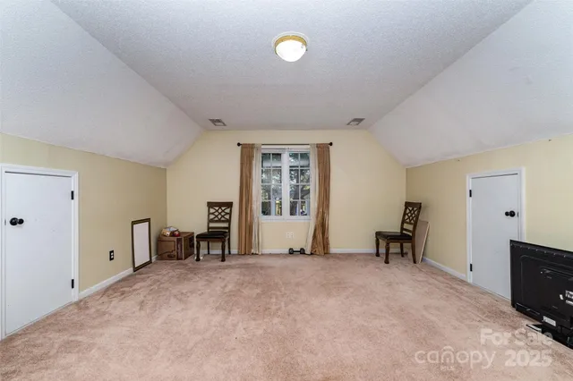 a view of kitchen with furniture and windows