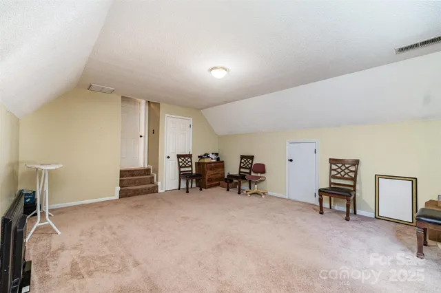 a view of a livingroom with furniture and a window