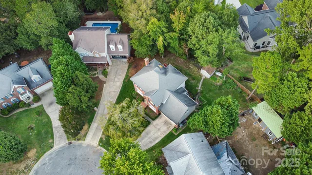 an aerial view of a house with outdoor space and street view