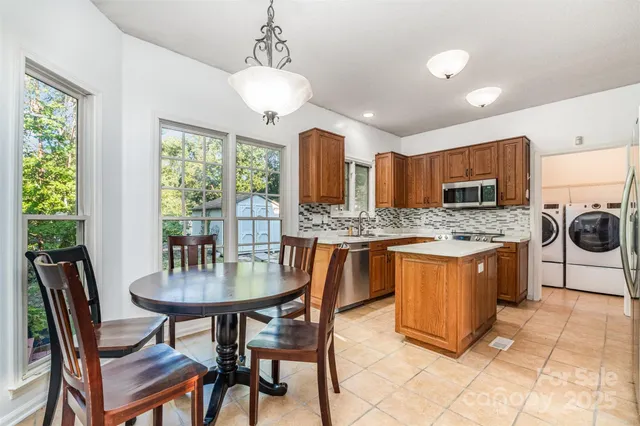 a view of a dining room with furniture window and outside view