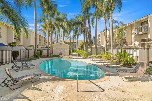 a view of a swimming pool with a lounge chairs
