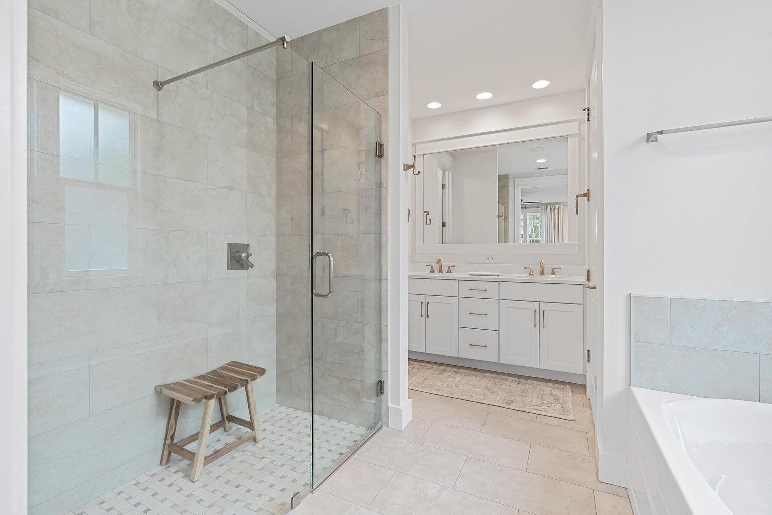 51 Sandchase Circle Watersound, FL 32461 - Photo 15 of 24 a bathroom with a shower a sink and a mirror