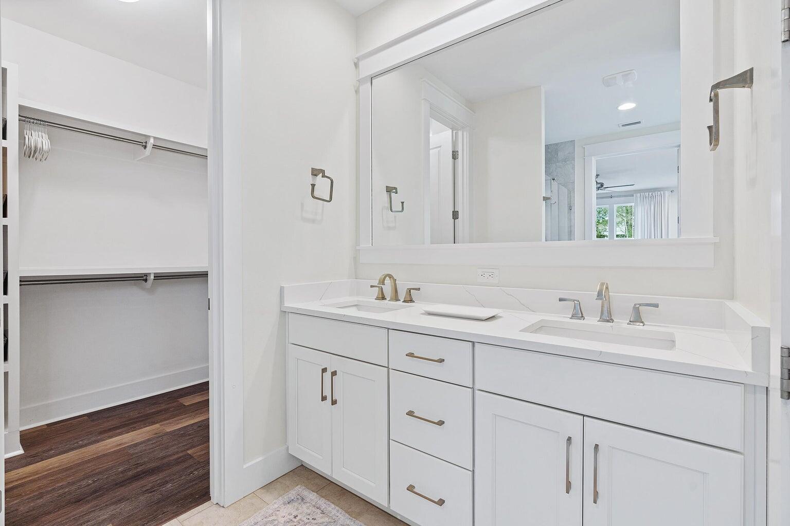 51 Sandchase Circle Watersound, FL 32461 - Photo 16 of 24 a bathroom with double sink and a mirror
