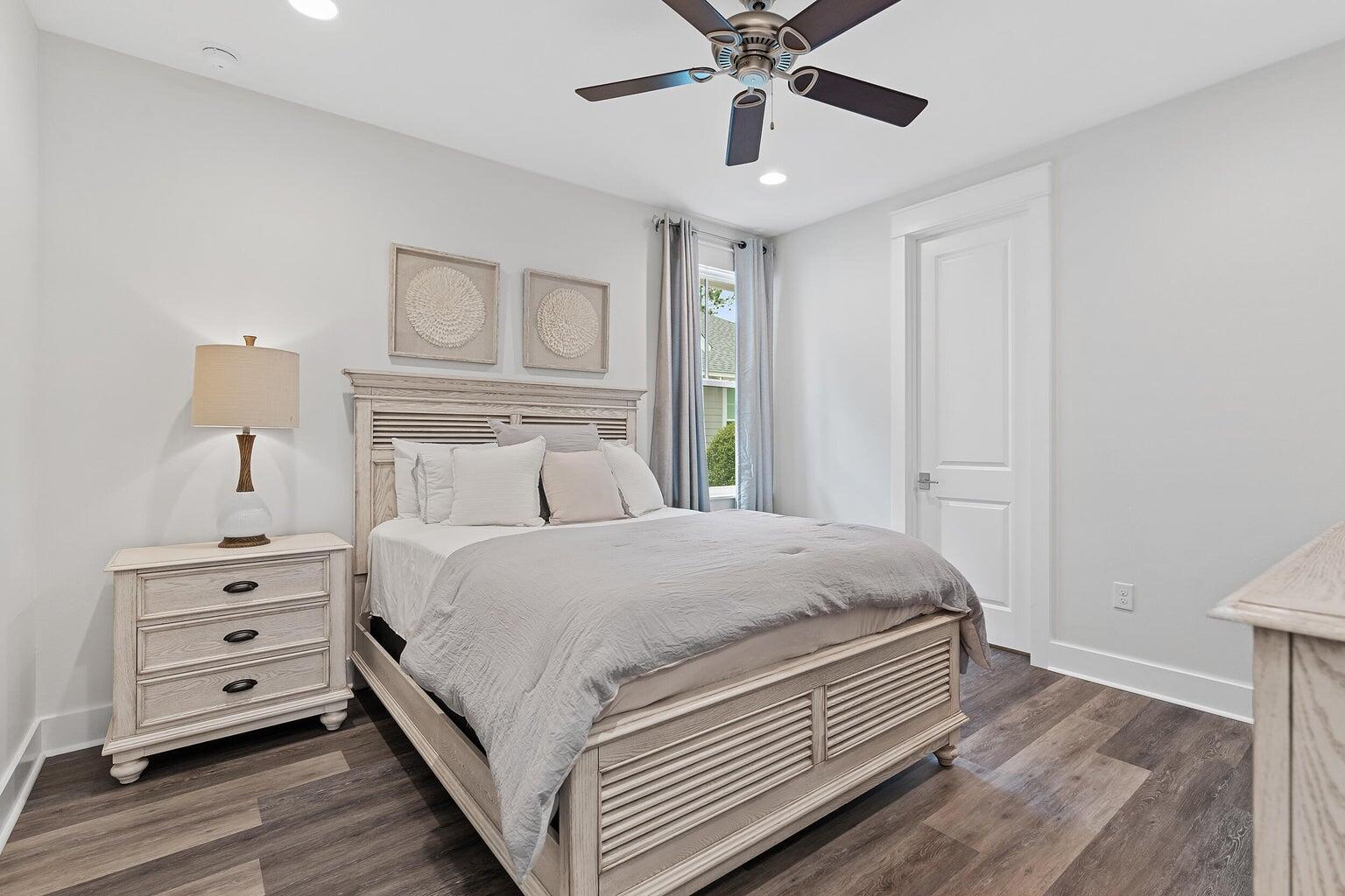 51 Sandchase Circle Watersound, FL 32461 - Photo 20 of 24 a bedroom with a bed and a dresser