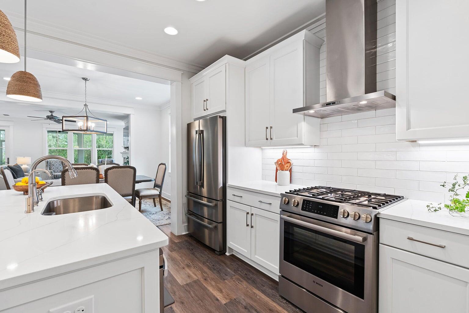 51 Sandchase Circle Watersound, FL 32461 - Photo 8 of 24 a kitchen with appliances cabinets and a counter space