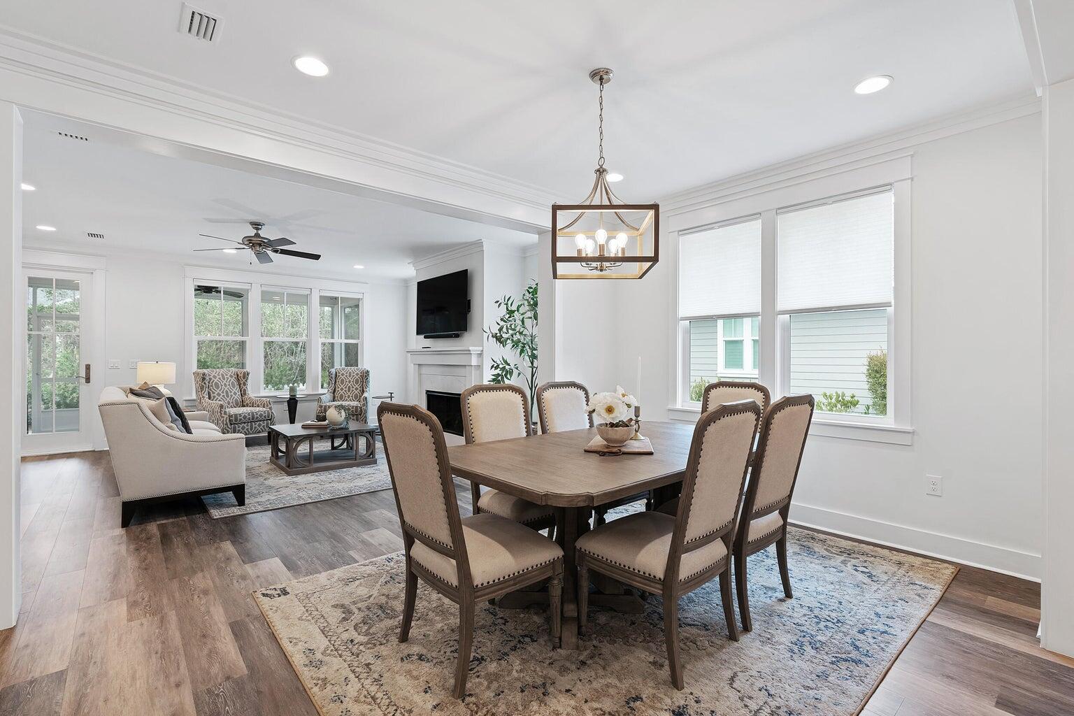 51 Sandchase Circle Watersound, FL 32461 - Photo 10 of 24 a view of a dining room with furniture window and wooden floor