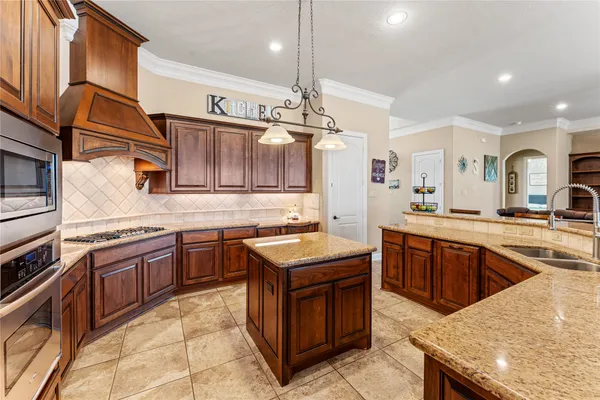 a bathroom with a tub double vanity sink and mirror
