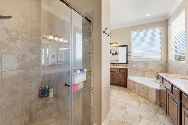 a bathroom with a sink double vanity and a mirror