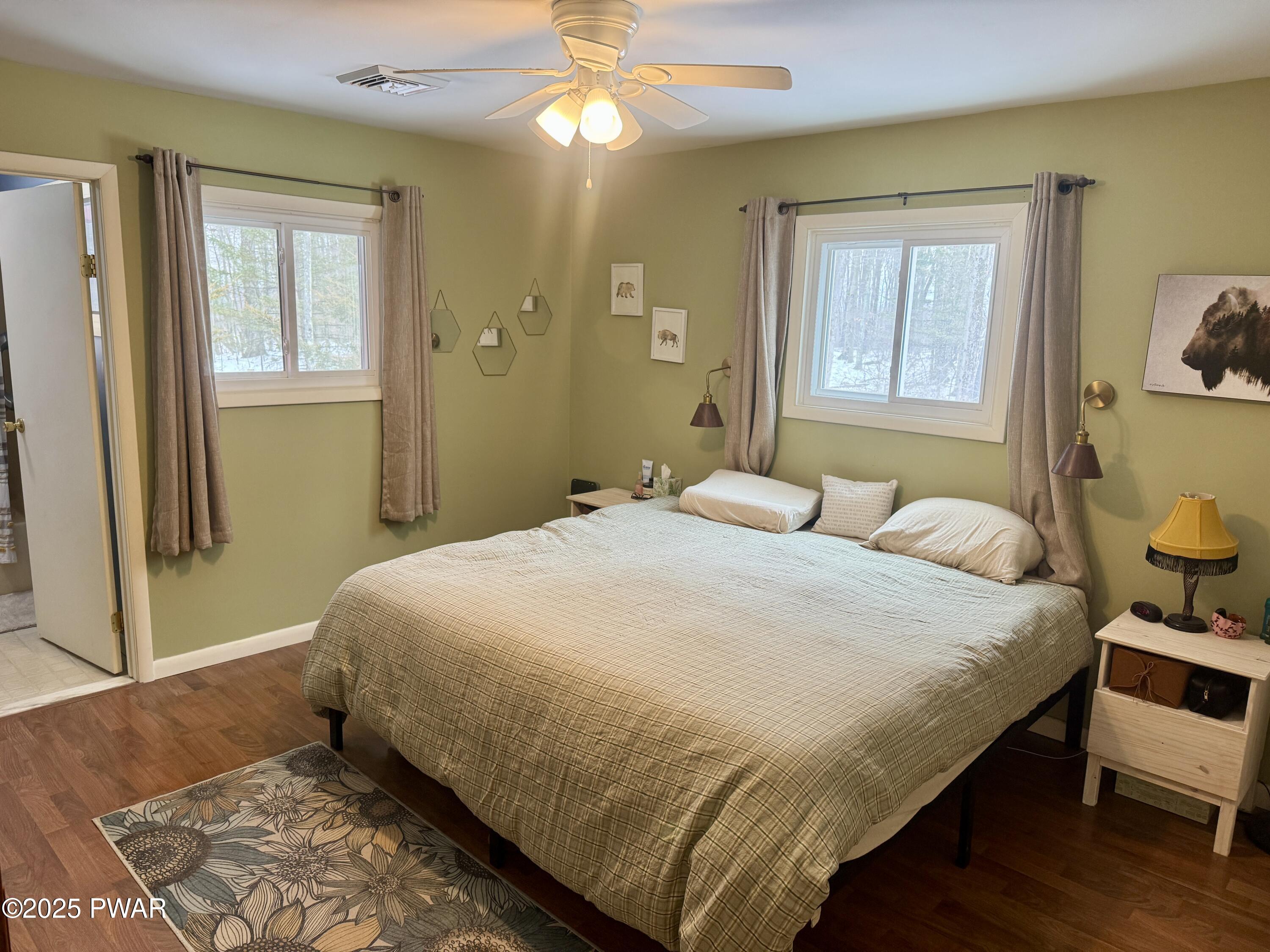 360 South Baker Road Waymart, PA 18472 - Photo 14 of 35 a bedroom with a bed and wooden floor