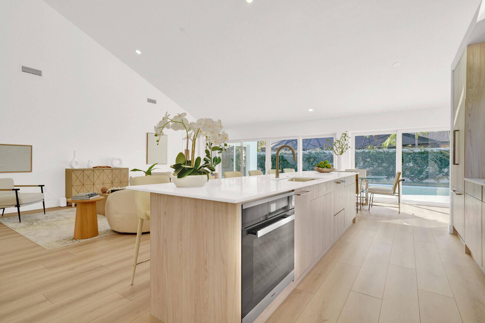 418 River Edge Road Jupiter, FL 33477 - Photo 14 of 44 a large white kitchen with a large window