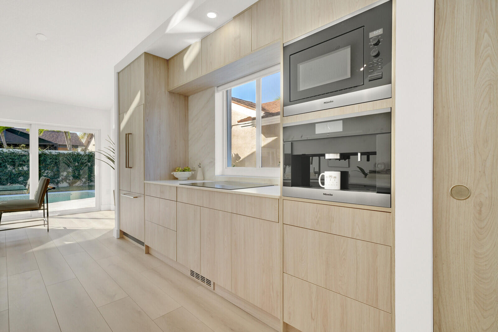 418 River Edge Road Jupiter, FL 33477 - Photo 15 of 44 a bathroom with a sink a mirror and next to a window