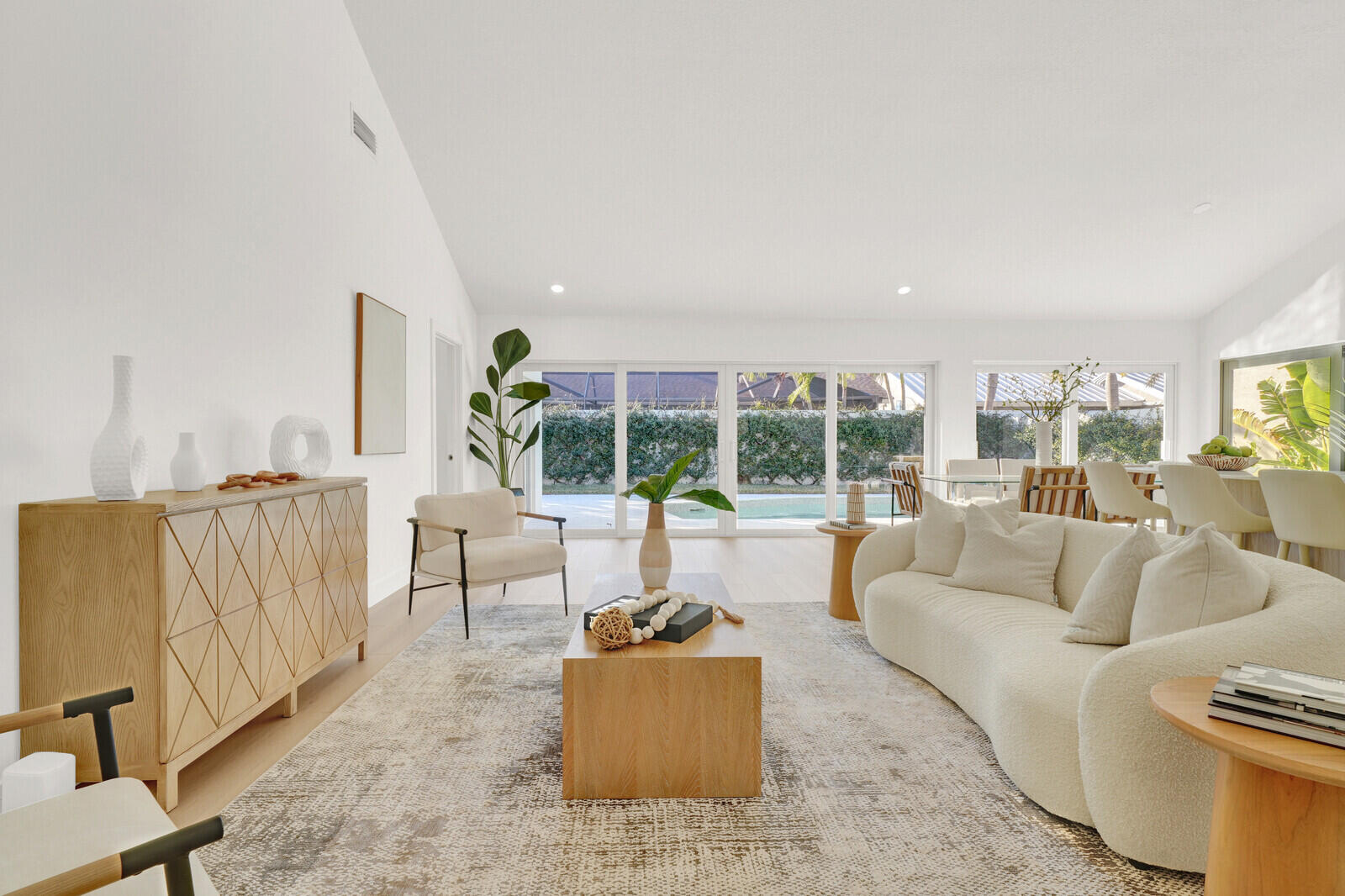 418 River Edge Road Jupiter, FL 33477 - Photo 16 of 44 a living room with furniture and a large window