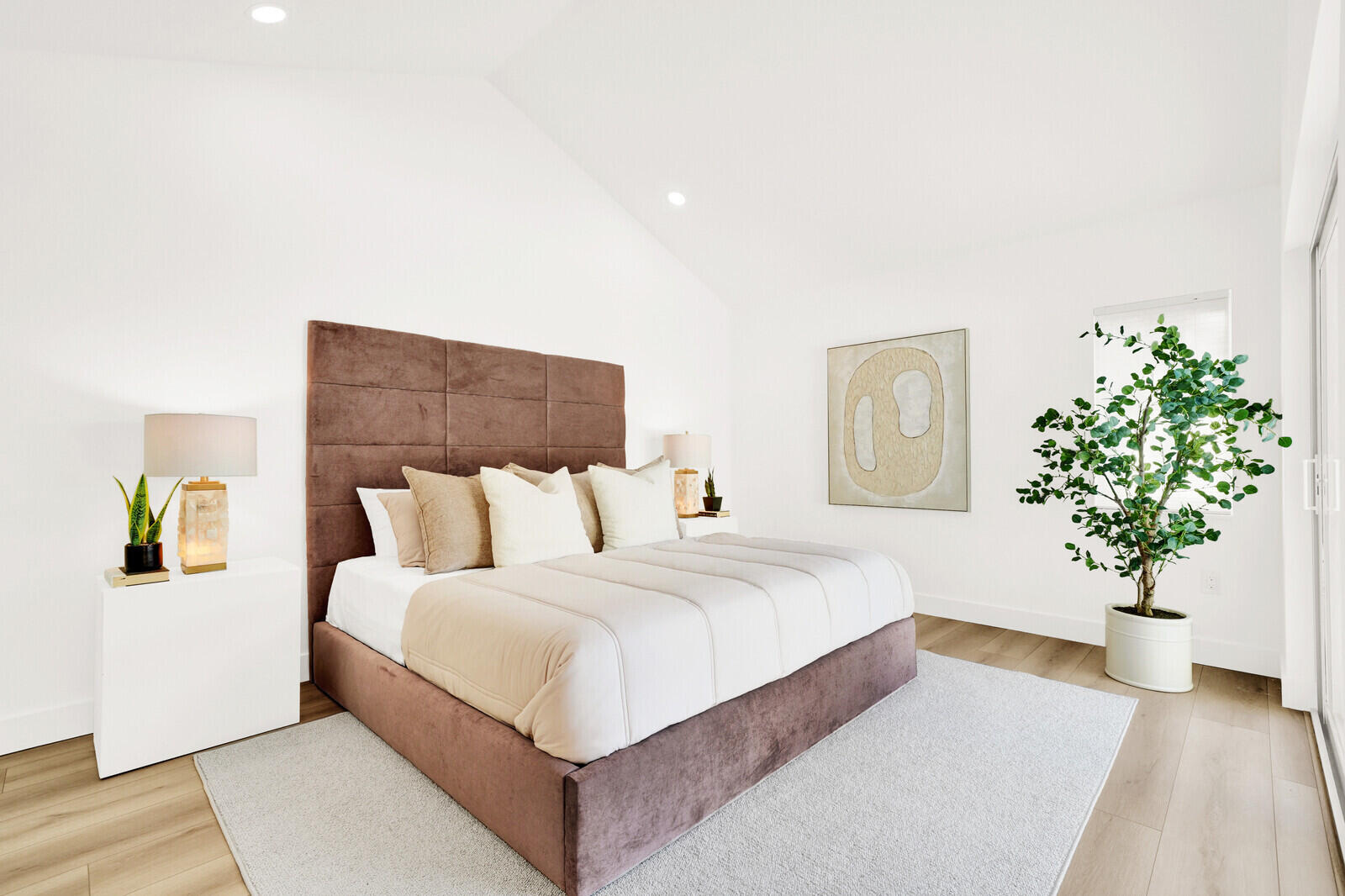 418 River Edge Road Jupiter, FL 33477 - Photo 18 of 44 a bedroom with a large bed and a potted plant