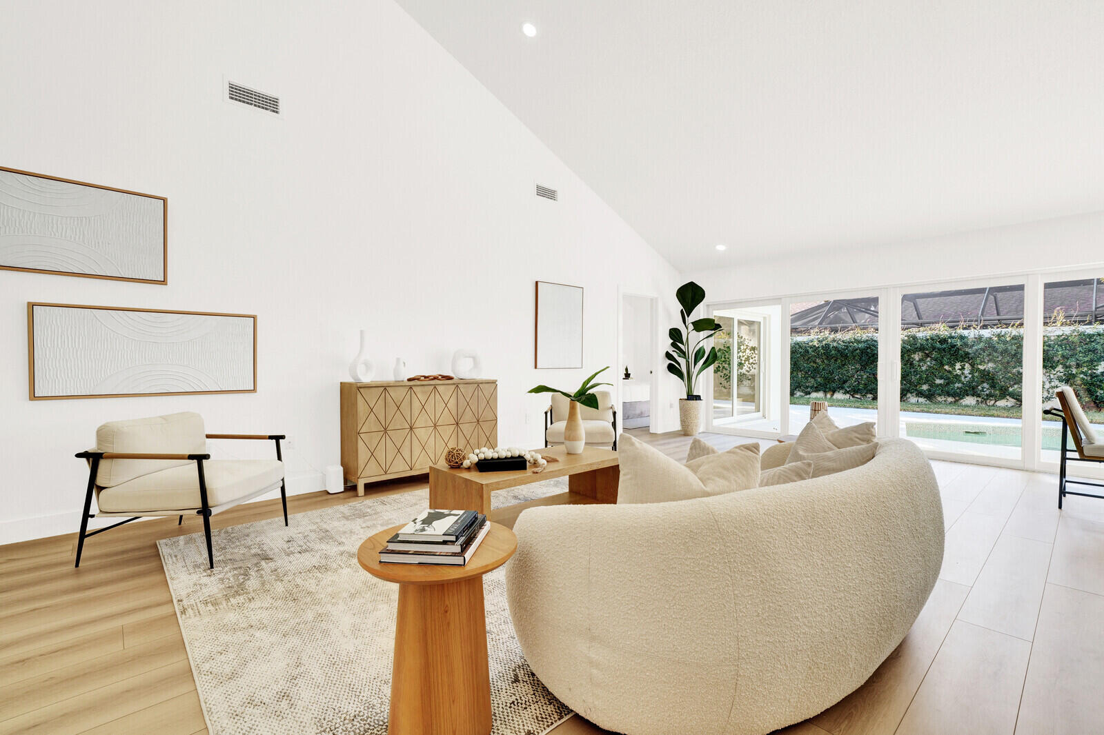 418 River Edge Road Jupiter, FL 33477 - Photo 2 of 44 a living room with furniture and a wooden floor