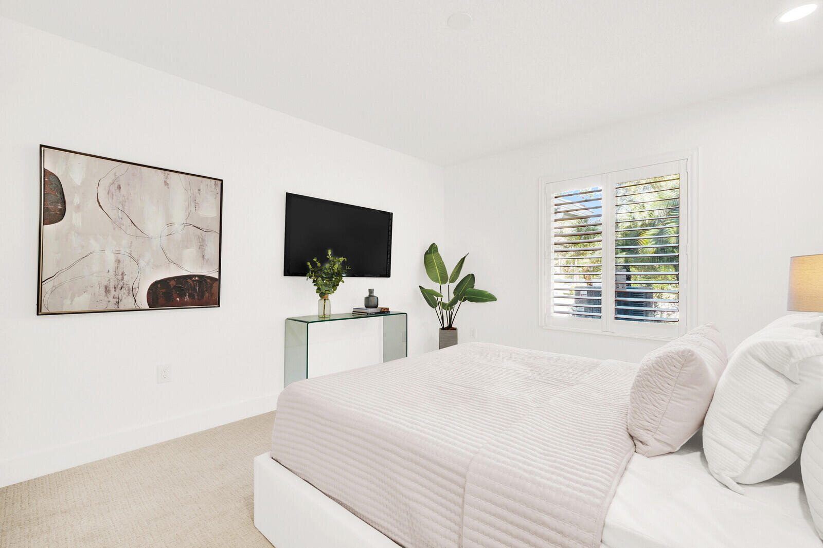 418 River Edge Road Jupiter, FL 33477 - Photo 28 of 44 a bedroom with a large bed and a flat tv screen on dresser