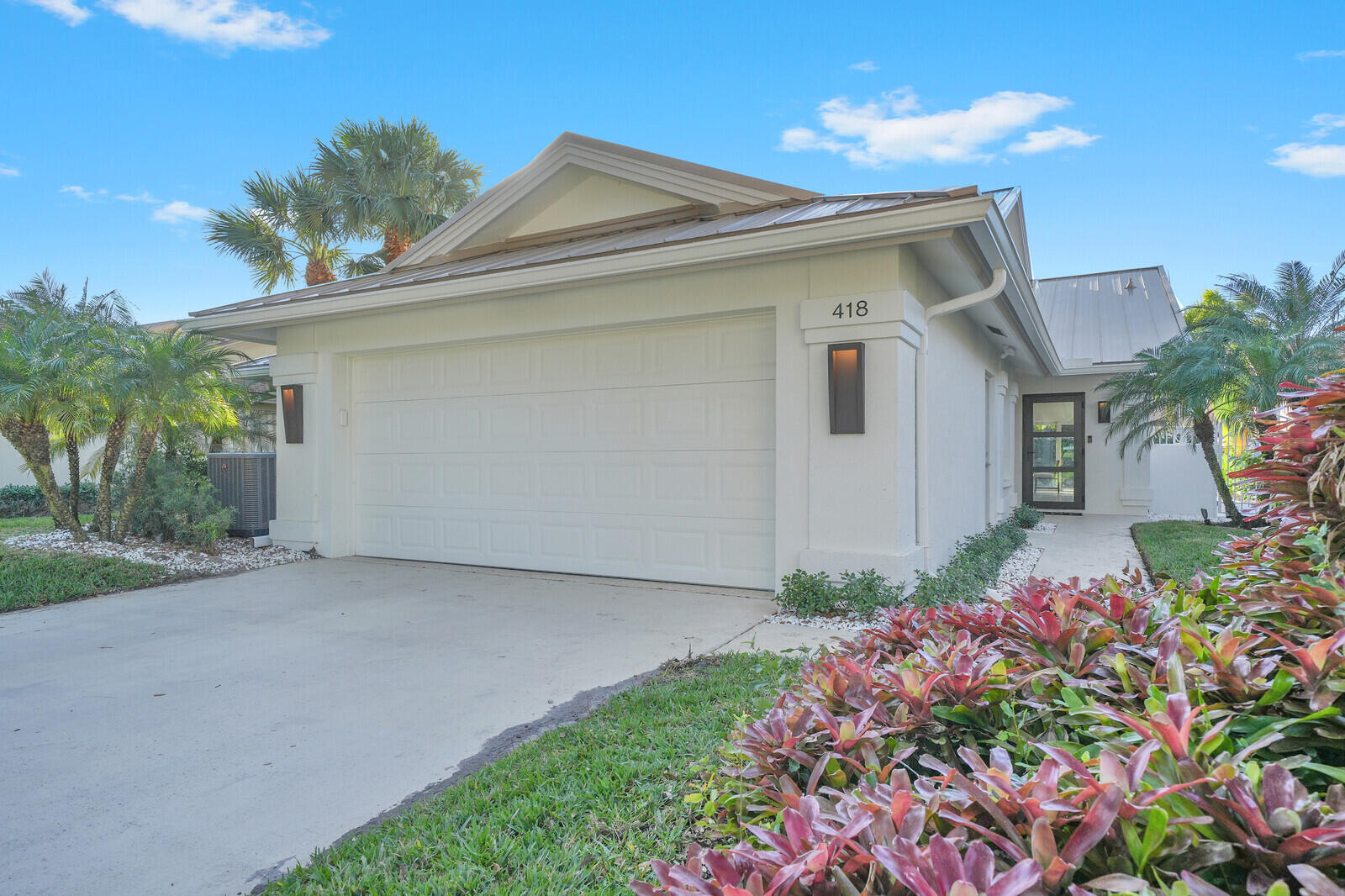 418 River Edge Road Jupiter, FL 33477 - Photo 44 of 44 a front view of a house with a yard