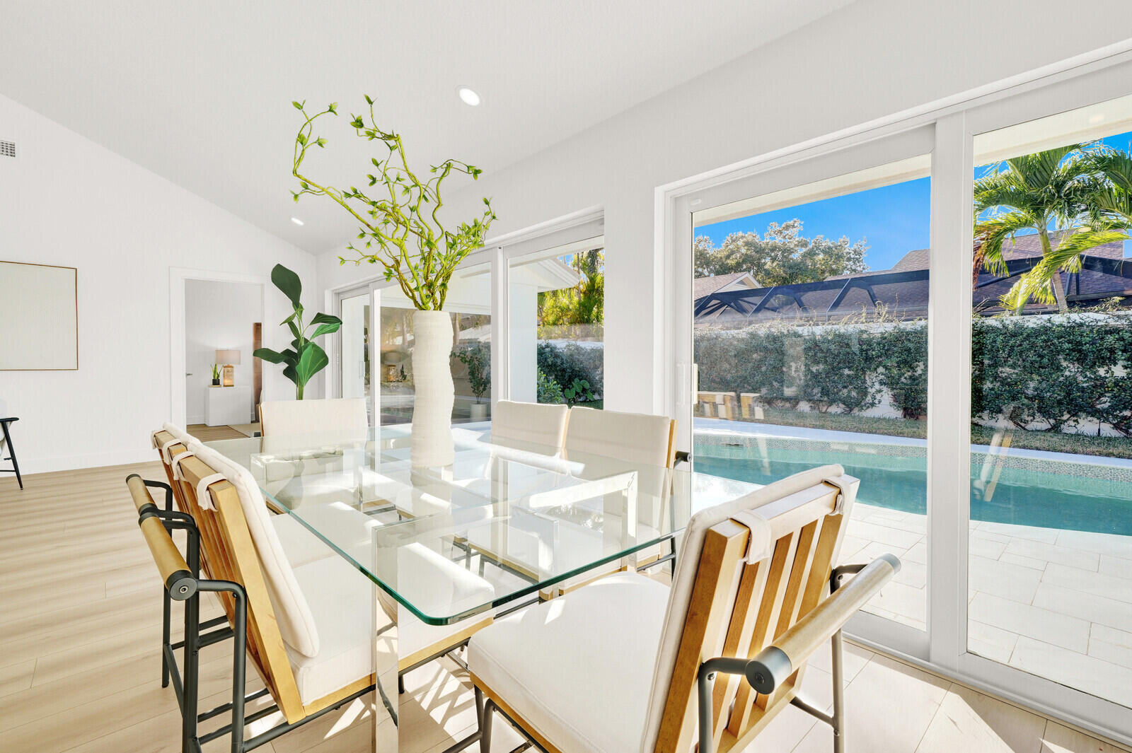 418 River Edge Road Jupiter, FL 33477 - Photo 7 of 44 a view of a dining room with furniture a livingroom and chandelier