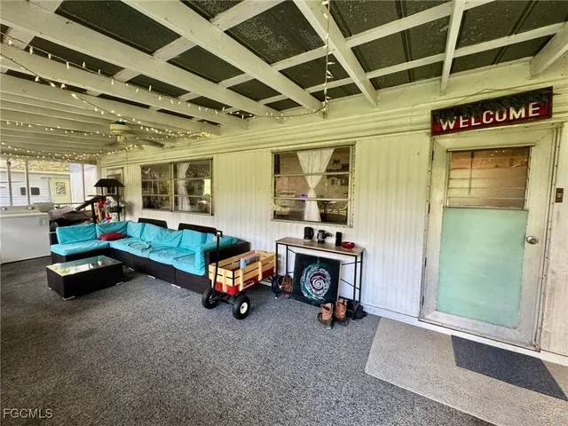 a car room with furniture and a window