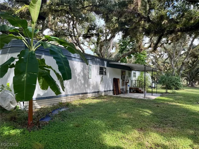 a house view with a sitting space and garden