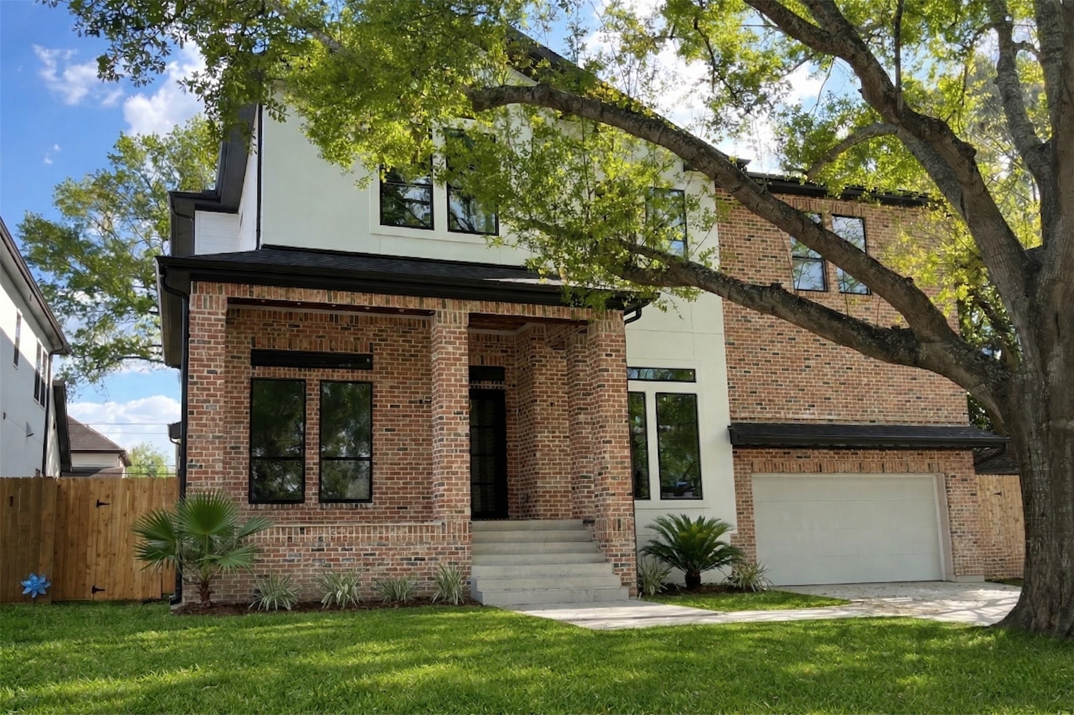 4623 Verone Street Bellaire, TX 77401 - Photo 1 of 8 a front view of a house with a yard