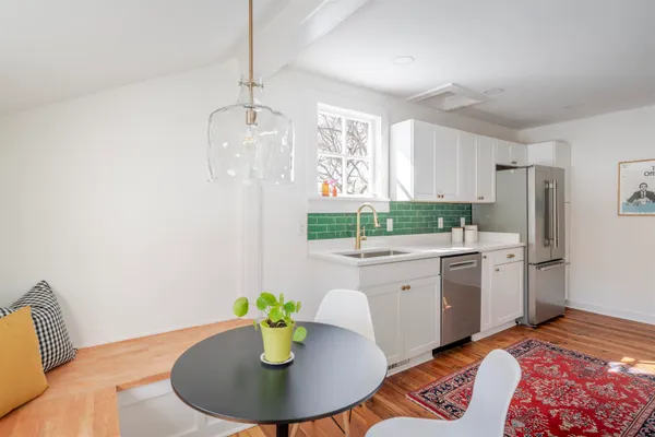 a kitchen with a sink and refrigerator