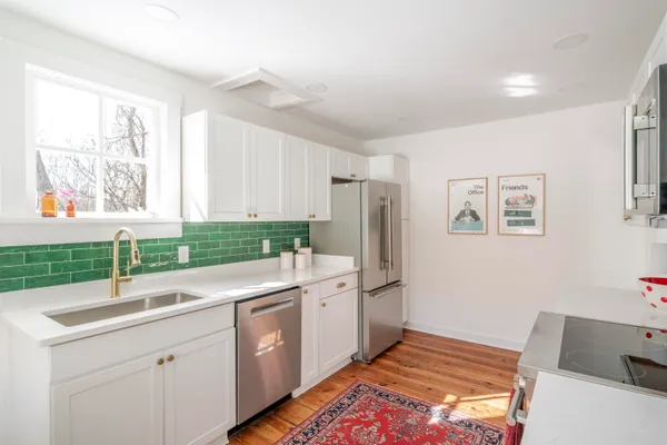 a kitchen with a sink and cabinets