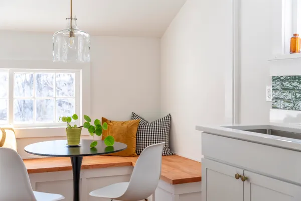 a dining room with furniture and window