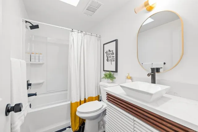 a bedroom with a bed and a large window with outer view