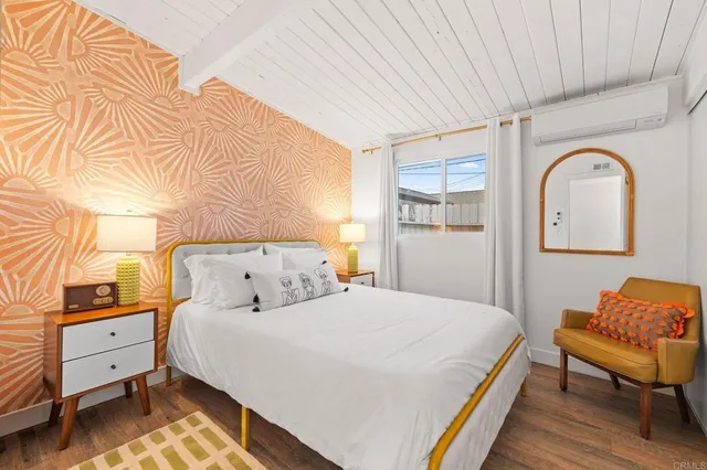 a bathroom with a toilet a sink and a mirror